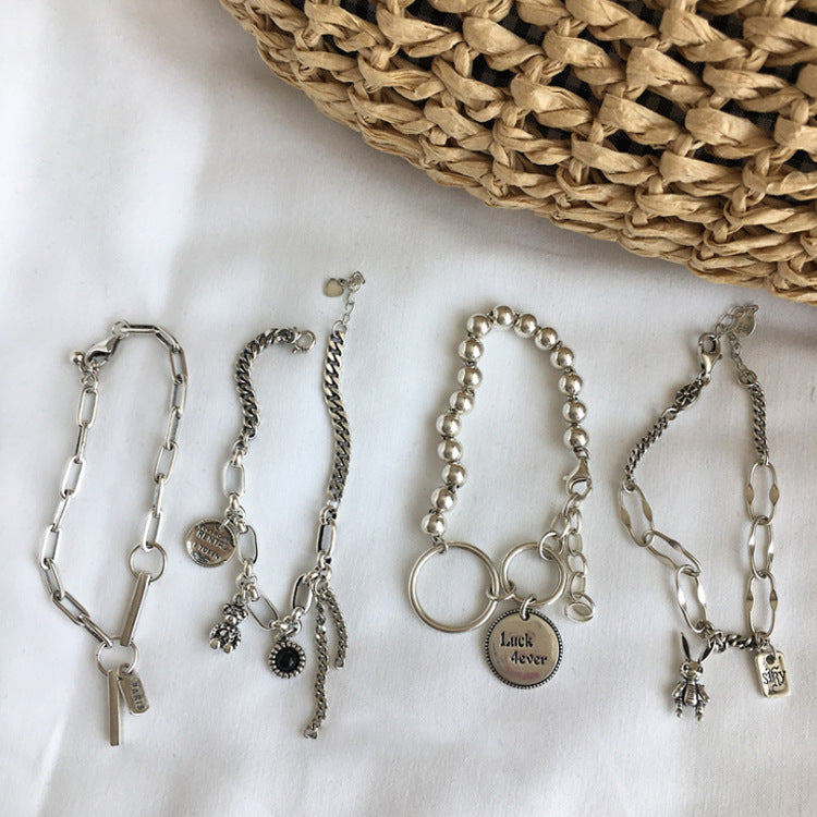 Mixed-Link Charm Bracelet with Contemporary Layered Style