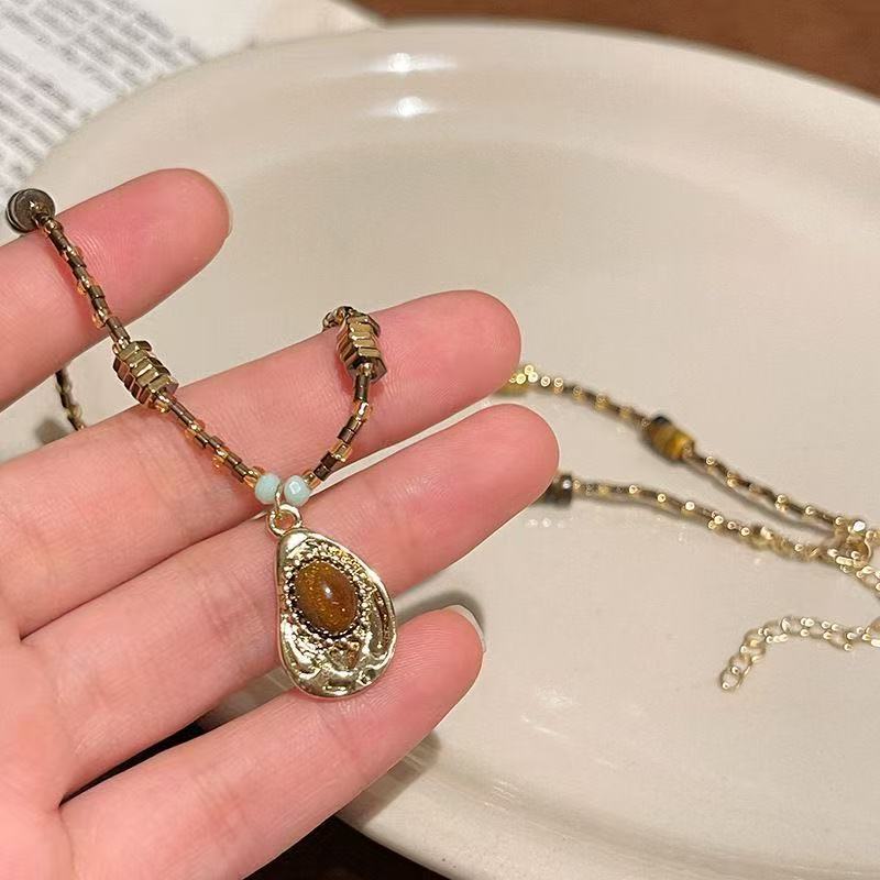 Vintage Gold Beaded Necklace with Teardrop Pendant