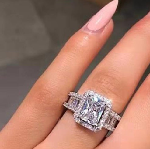 Emerald Cut Halo Engagement Ring with Baguette Accents