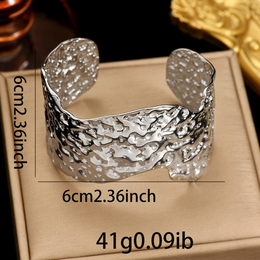 Sculptural Hammered Cuff Bracelet with Fluid Wave Design