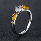 Golden Vine Solitaire Ring – Two-Tone Leaf Accent Design