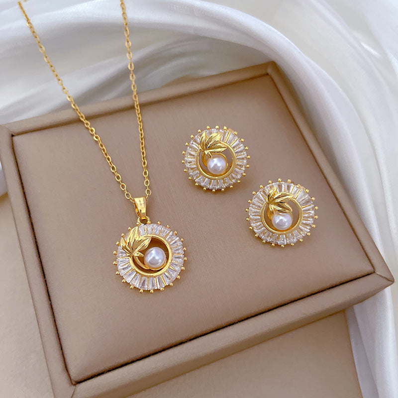 Gold Crystal Sun Pendant Necklace with Pearl Center