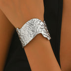 Sculptural Hammered Cuff Bracelet with Fluid Wave Design