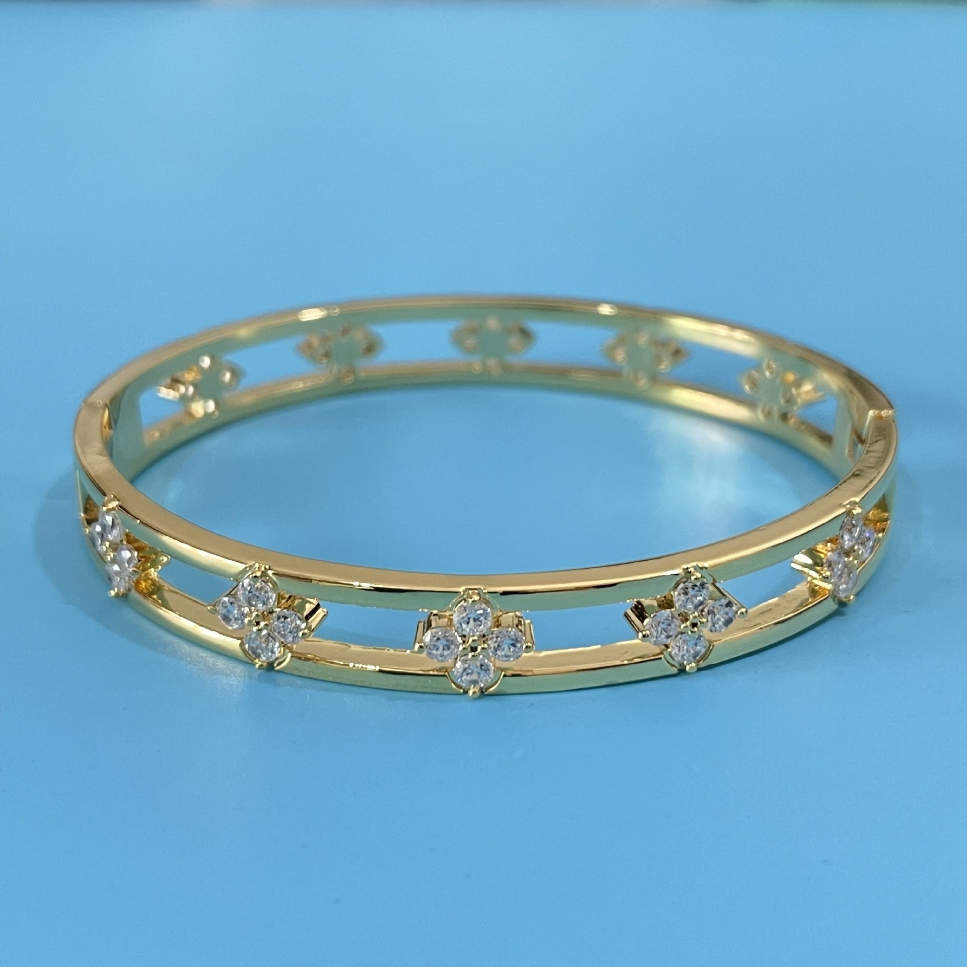 Floral Detail Bangle Bracelet with Elegant Openwork Design