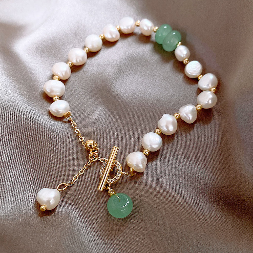 Elegant Freshwater Pearl Bracelet with Green Accent Charm