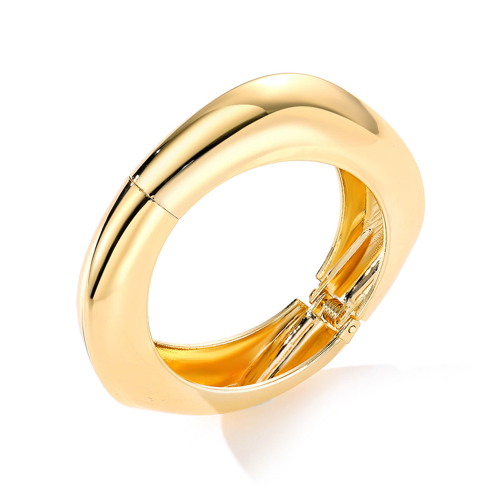 Polished Gold-Tone Bangle Bracelet with Elegant Curve