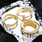 Polished Gold-Tone Bangle Bracelet with Elegant Curve
