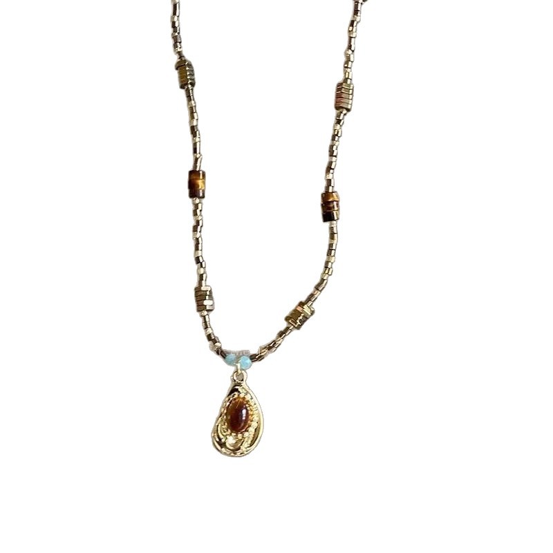 Vintage Gold Beaded Necklace with Teardrop Pendant