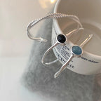 Slim Open Bangle Bracelet with Central Stone Detail