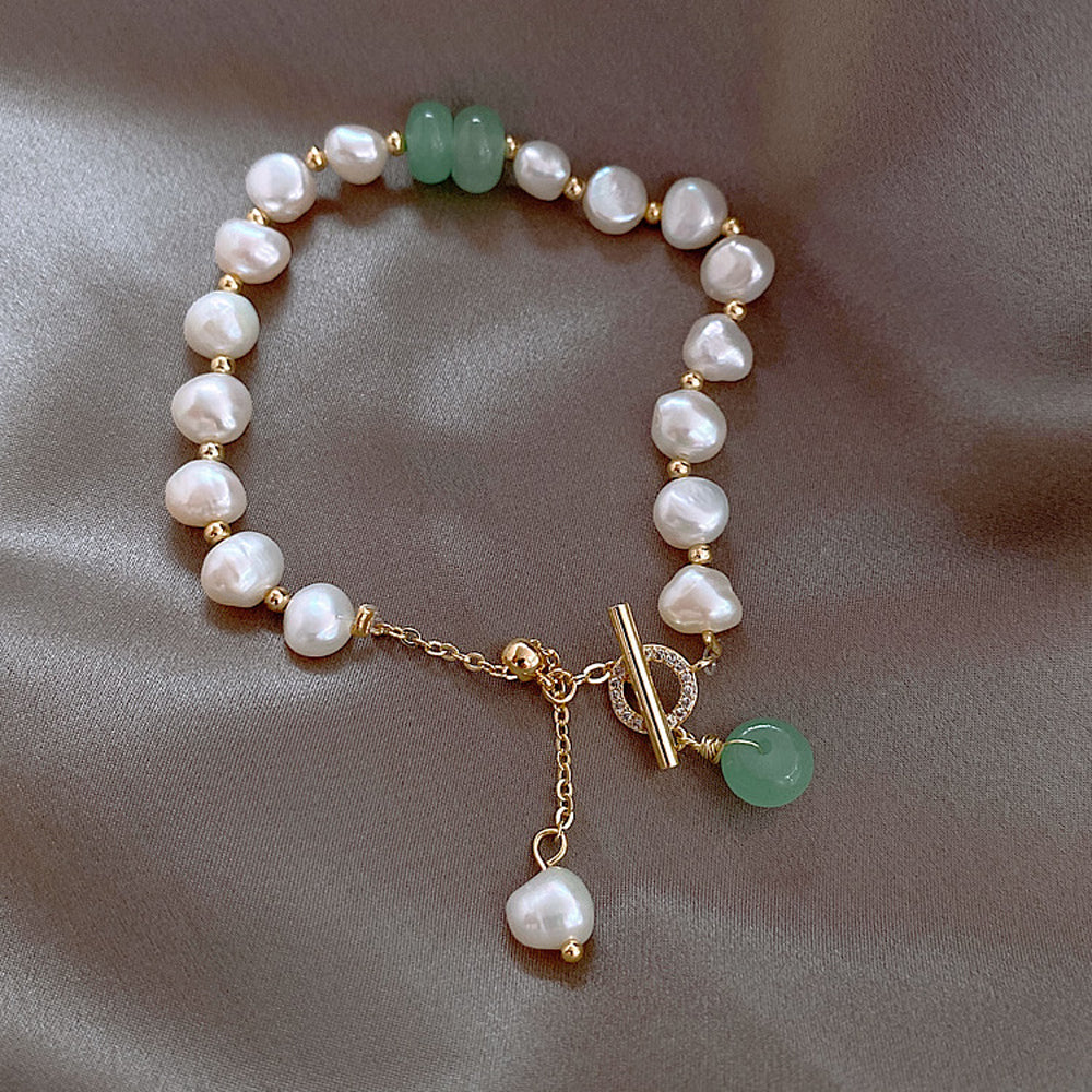 Elegant Freshwater Pearl Bracelet with Green Accent Charm