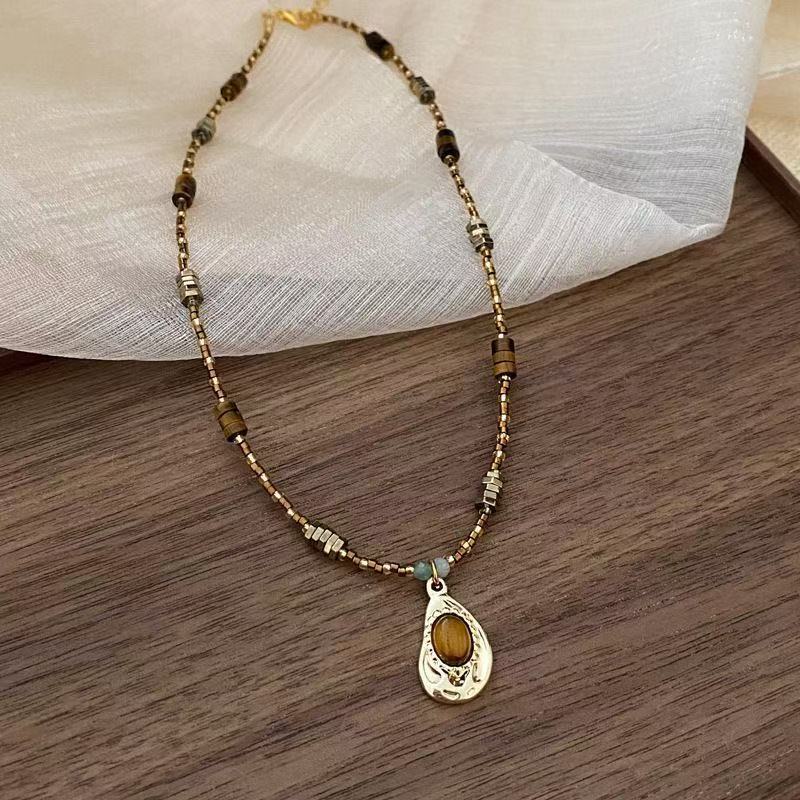 Vintage Gold Beaded Necklace with Teardrop Pendant