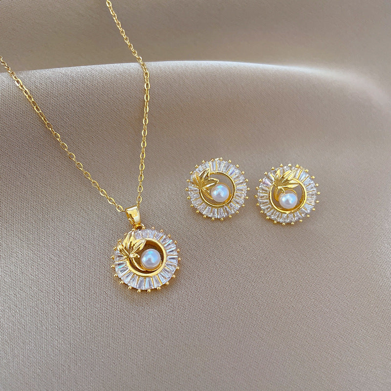 Gold Crystal Sun Pendant Necklace with Pearl Center