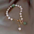 Elegant Freshwater Pearl Bracelet with Green Accent Charm