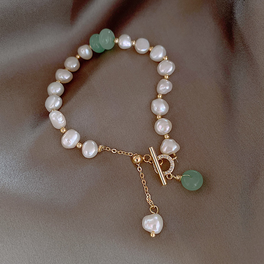 Elegant Freshwater Pearl Bracelet with Green Accent Charm